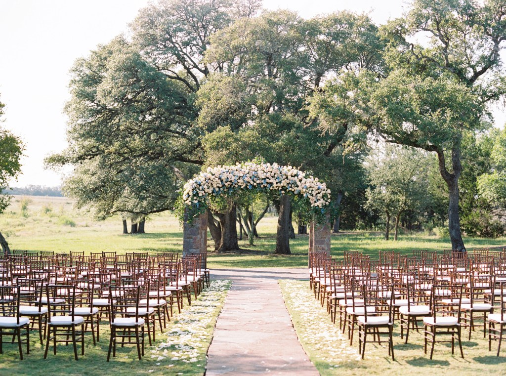 Outdoor Ceremony Site at Ma Maison set with Fruitwood Chiavari Chairs